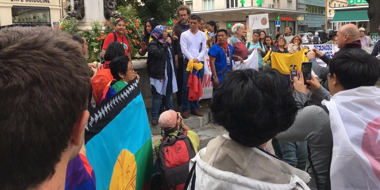 Image of protesters at a Climate Justice rally: Trade & Investment Agreements and Human Rights