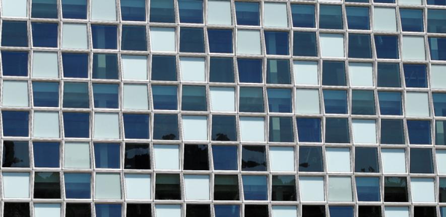 Image of blue and white windows of the International Criminal Court, The Hague