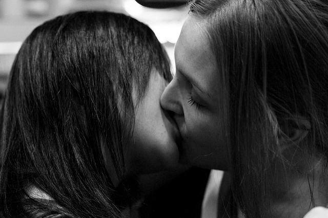 Photo of a couple kissing.