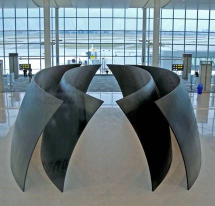 Richard Serra, Tilted Spheres, 2002-2004, Cor-ten steel, 14' x 39' x 22'. Pearson International Airport, Toronto, Canada