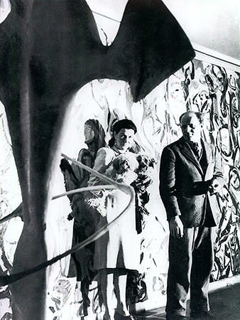 Jackson Pollock and Peggy Guggenheim in front of Mural, 1943, in Guggenheim's New York City apartment