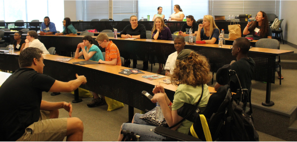 A photograph shows students in a classroom.