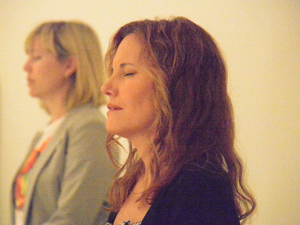 Photo of two women meditating.