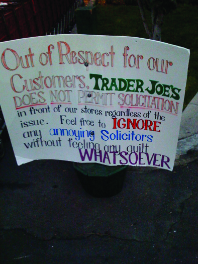 A photo of a sign. The sign reads "Out of respect for our customers, Trader Joe's does not permit solicitation in front of ou