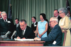 Photo of President Lyndon Johnson signing bill.