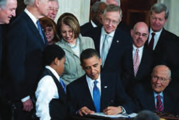 Photo of President Barack Obama signing the Affordable Care Act.