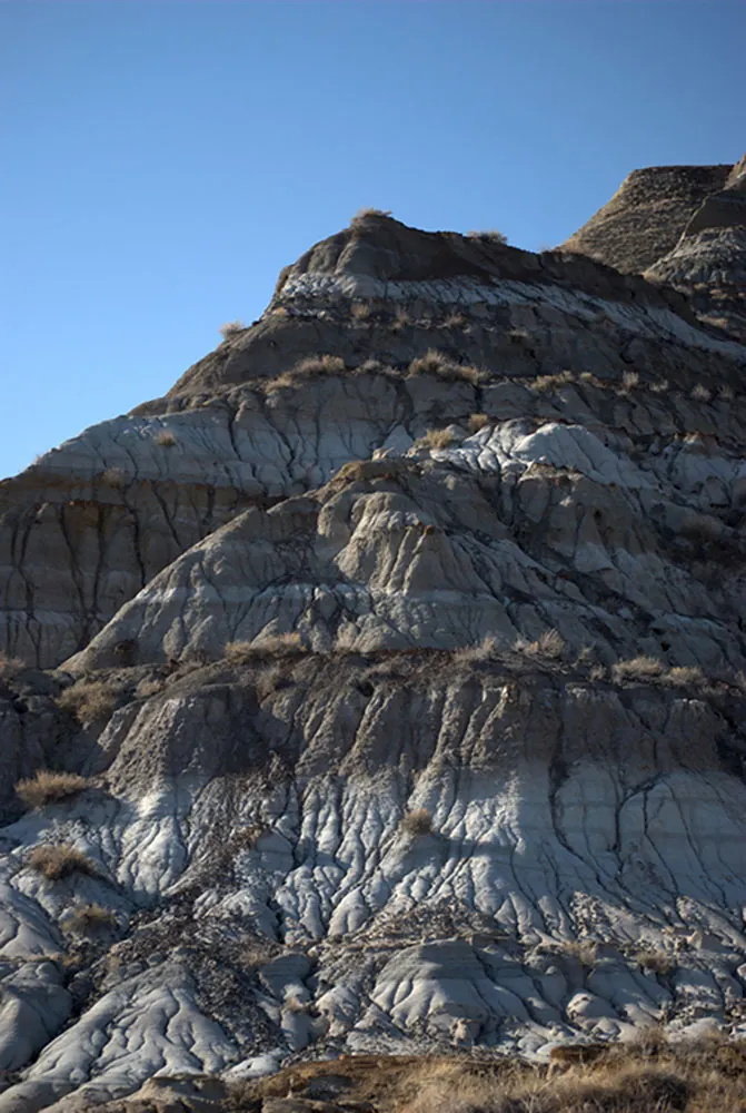 A rock formation showing various layers is shown.