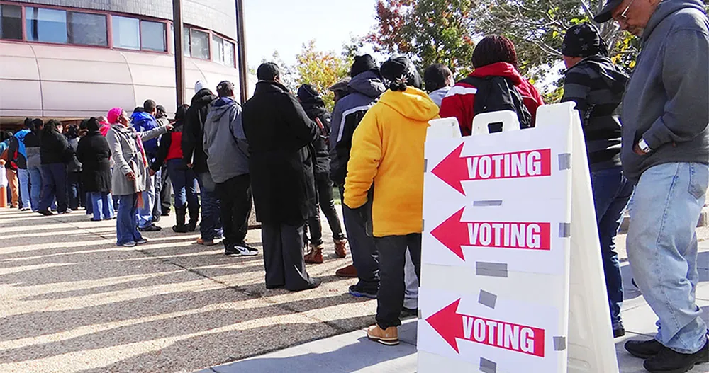 People wait online outside a voting location.