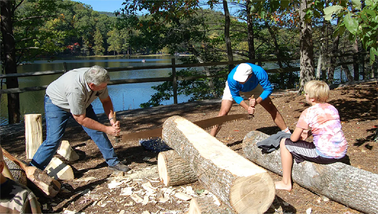 Image of two men at a crosscut saw event.