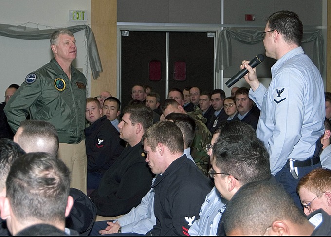 Damage Controlman 3rd Class Mark Gorley asks Adm. Gary Roughead a question during a Q&A session.